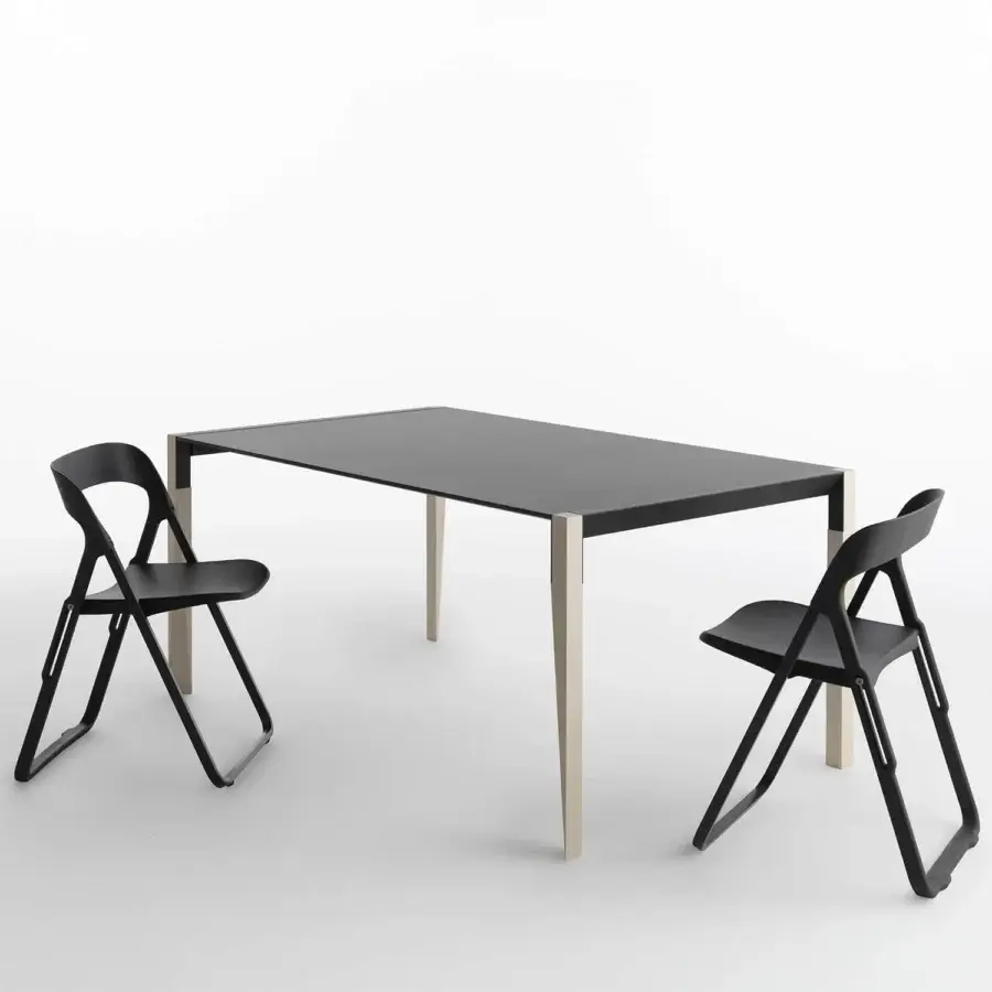 Distinctive Casamania Bek chair crafted in matte black synthetic material with a triangular opening backrest and fiberglass reinforced construction