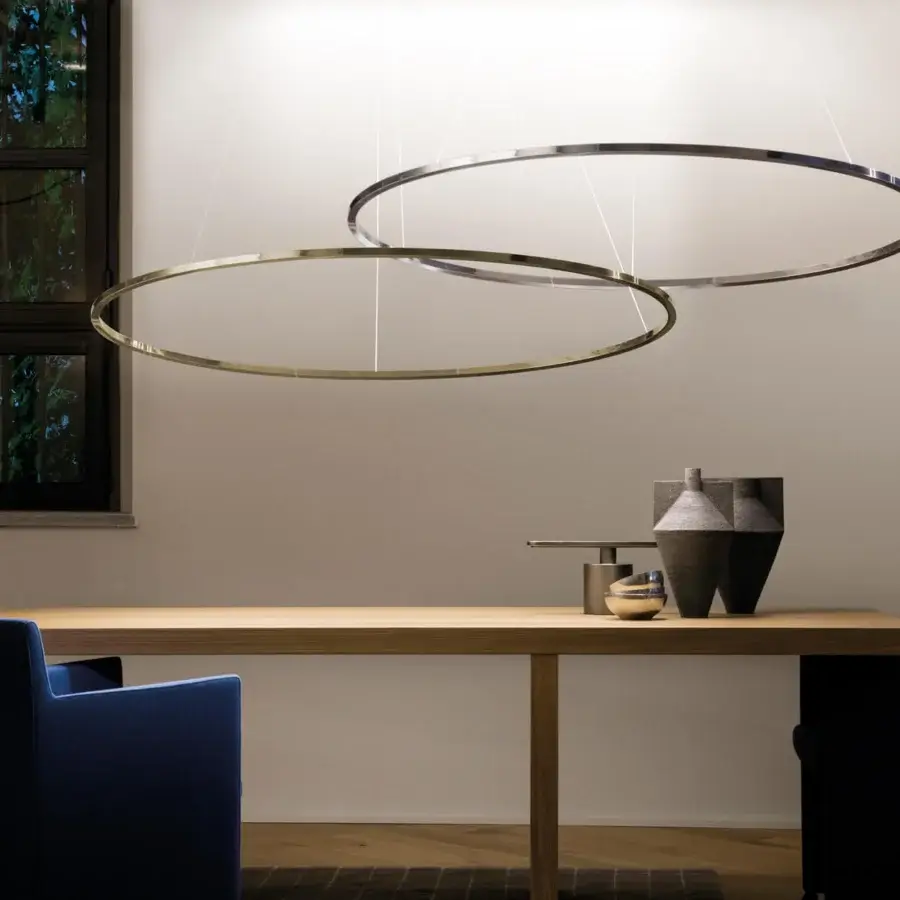 Superior Nemo Ellisse suspension lamp crafted with sleek curved silhouette in gold-toned metal providing diffused direct lighting