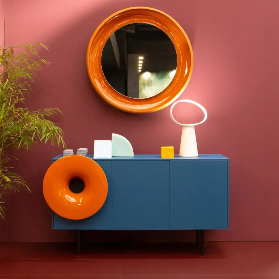 Avant-garde Miniforms Caruso bar cabinet in deep blue matte with a vibrant orange accent creating a modern design