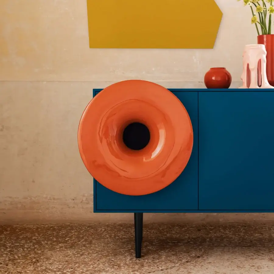 Superior Miniforms Caruso bar cabinet in deep blue high-gloss synthetic material with a striking orange speaker element and black legs