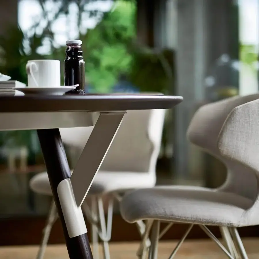 Elegant Varaschin Link table crafted in Italy with a dark wood-like top and powder-coated aluminum structure with a matte finish