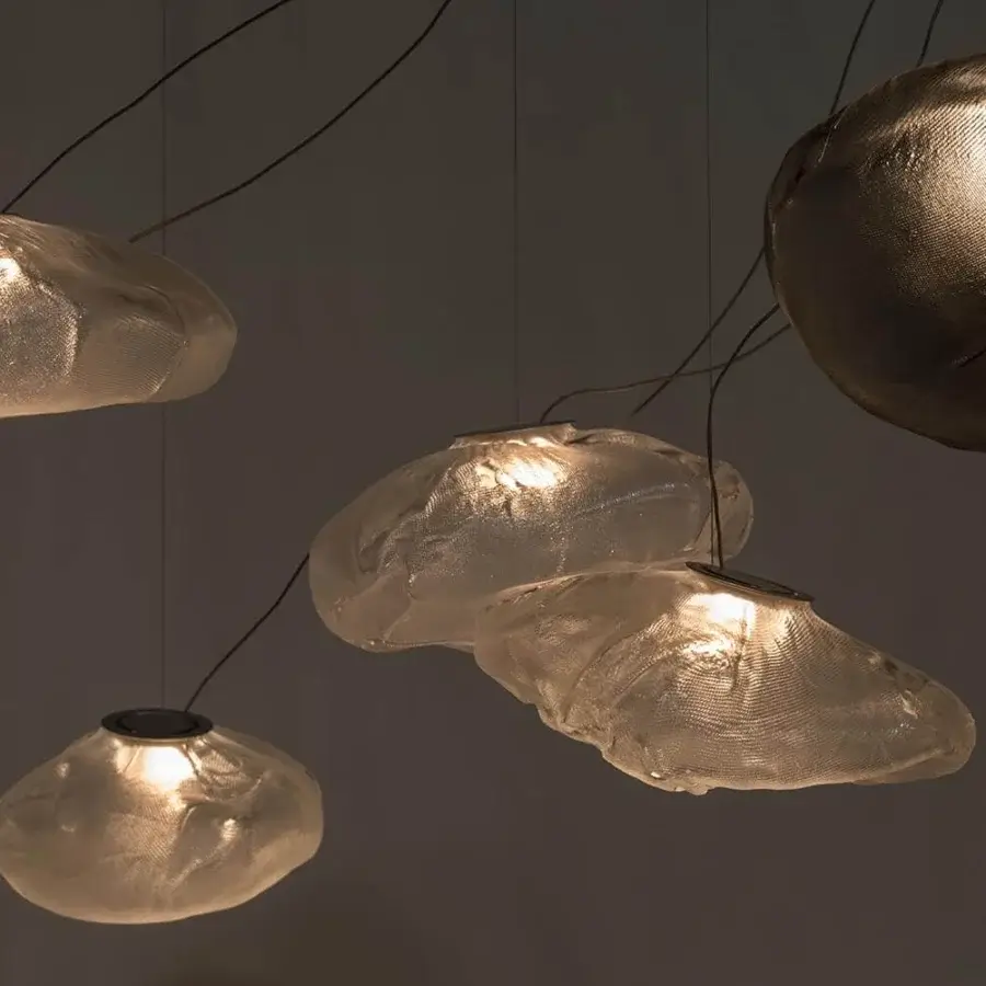 Exclusive Bocci 73 sculptural lamp crafted in light-colored blown glass with a glossy finish and braided metal coaxial cable