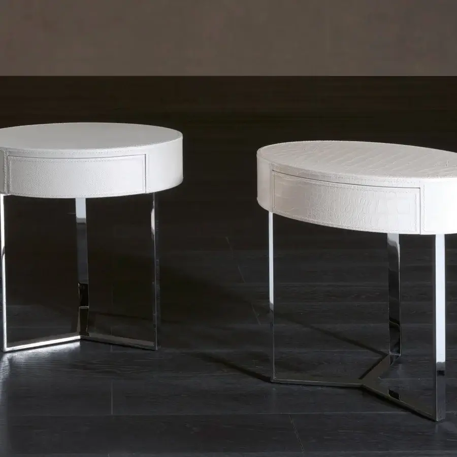 Elegant Rugiano Just nightstand with oval white leather top and polished steel Y-shaped base crafted for sophisticated bedrooms