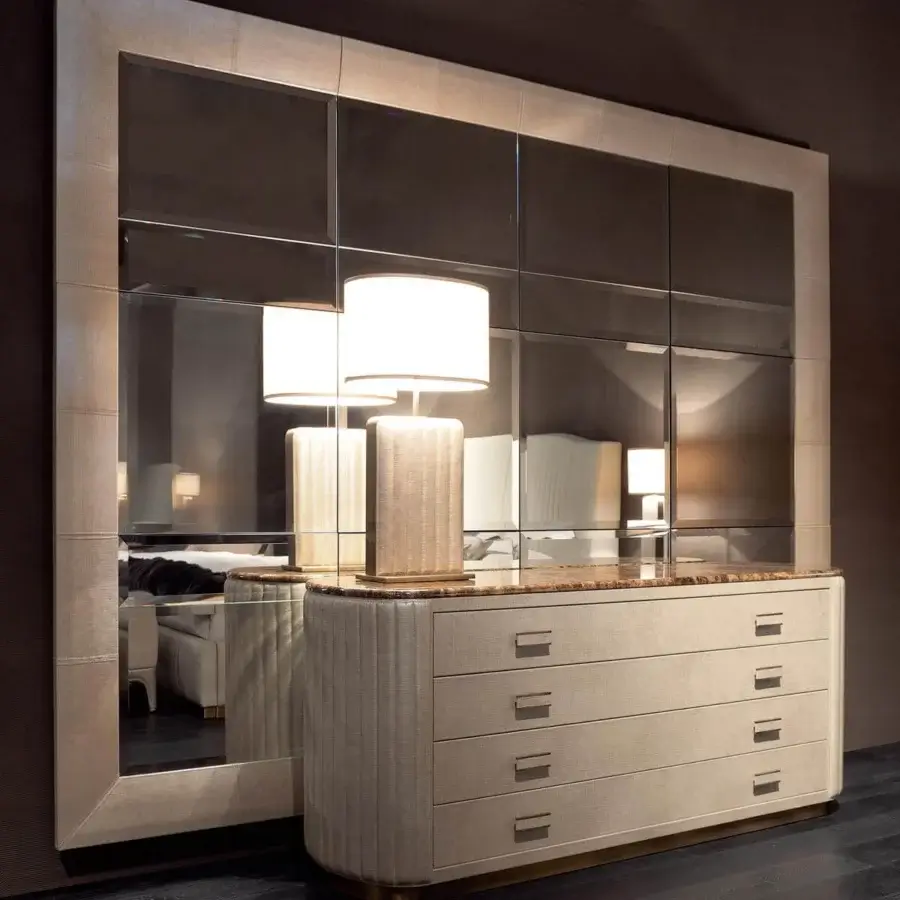 Lavish Rugiano Bach dresser with curved silhouette, leather drawers and a brass-like finish marble top