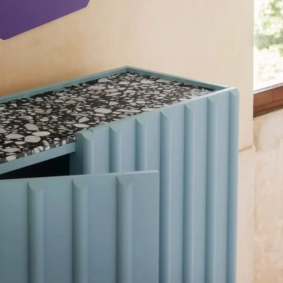 Superior Miniforms Containerup bar cabinet in light blue lacquer with a patterned black and white top and ridged door