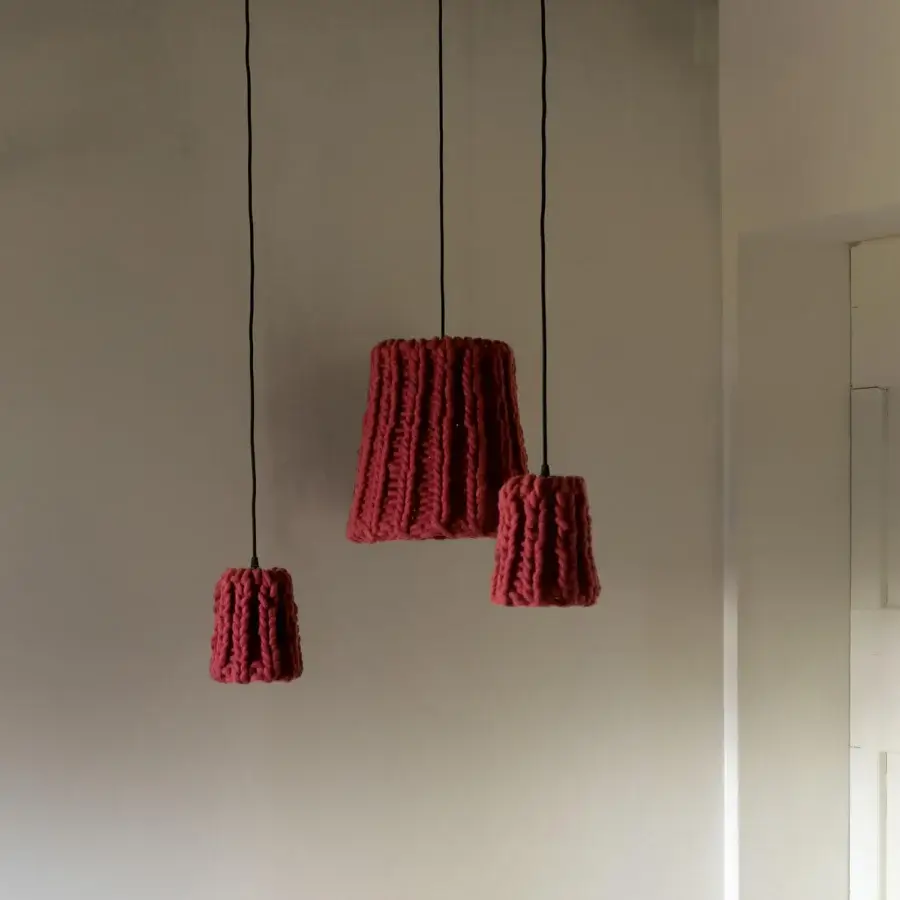 Distinguished Casamania Granny suspension crafted in muted red hand-woven wool with a thin black cable