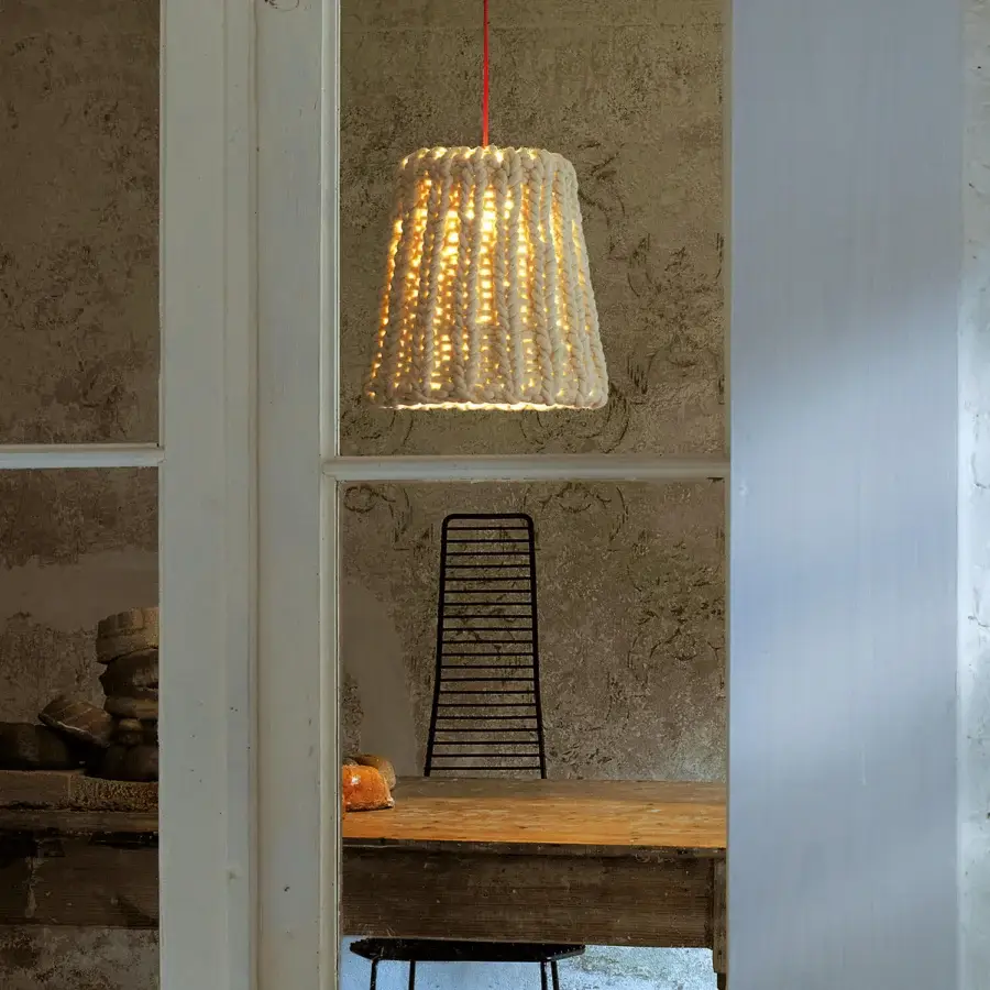 Superior Casamania Granny suspension crafted in creamy off-white hand-woven wool with a red cord