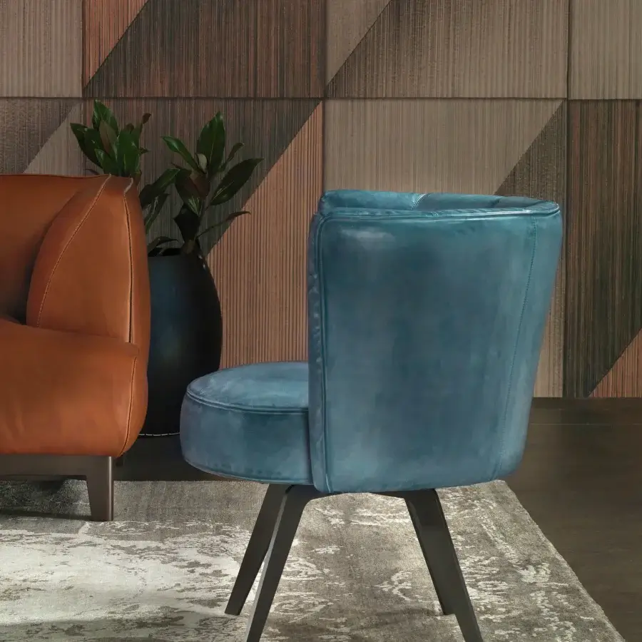 Distinguished Borzalino Diva lounge chair with curved lines and blue textile upholstery in a matte finish