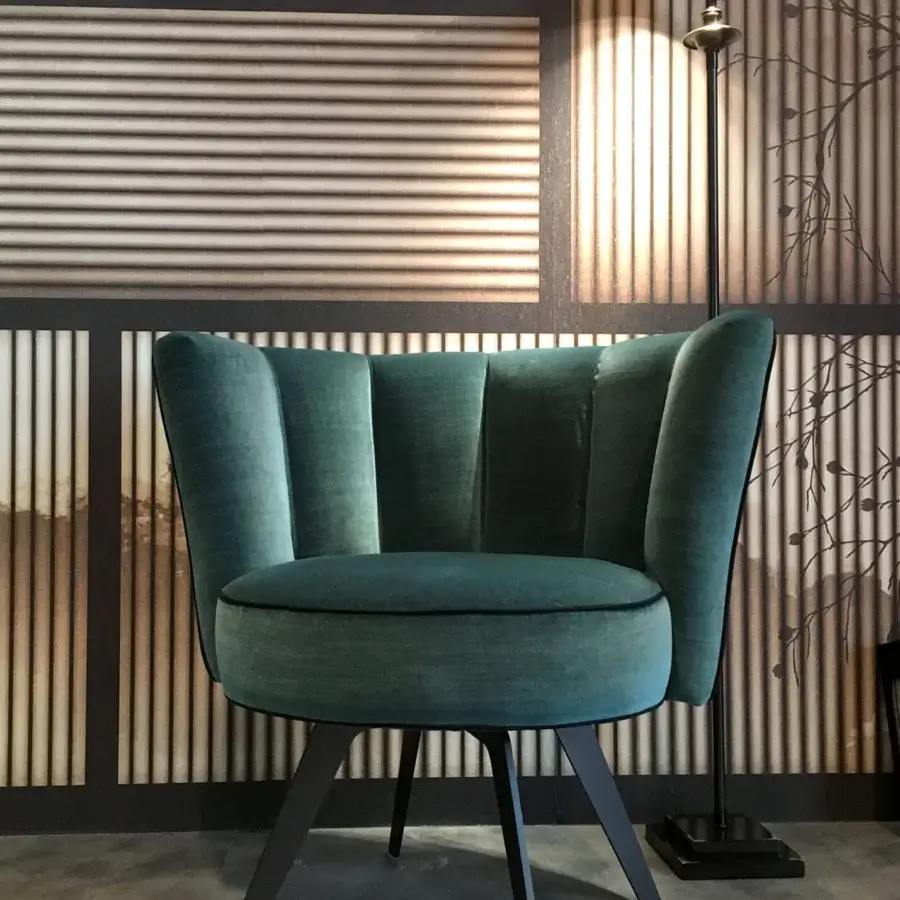 Sumptuous Borzalino Diva lounge chair in teal velvet upholstery with black piping and lacquered matte black metal base
