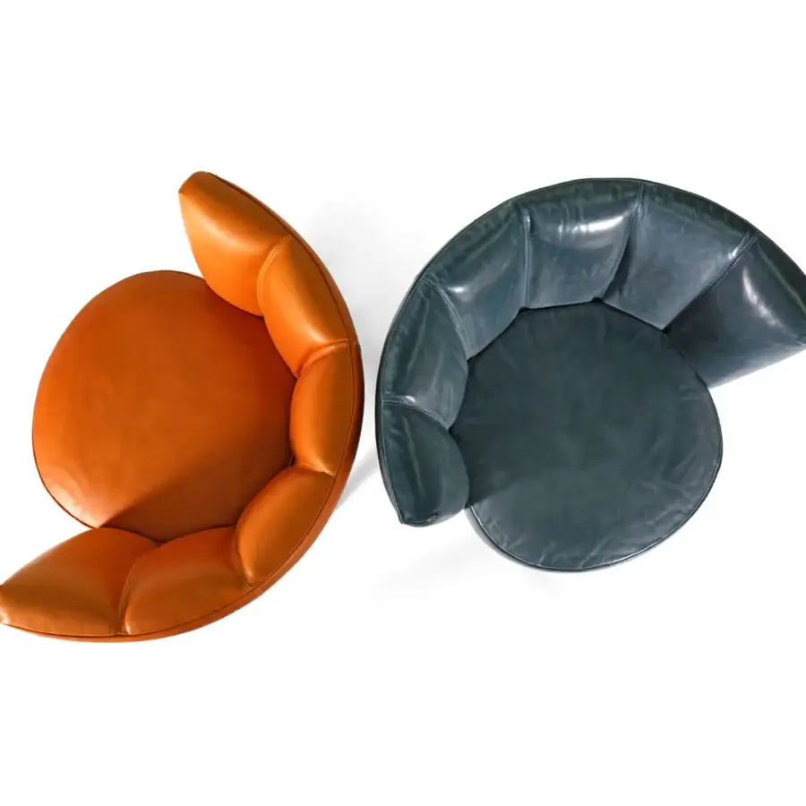 Distinguished Borzalino Diva lounge chair with shell backrest crafted in orange-brown leather and lacquered metal swivel base