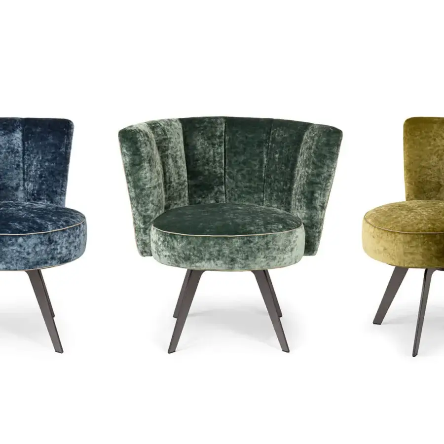 Distinguished Borzalino Diva lounge chair with art deco-inspired shell back upholstered in textured velvet with gold trim and dark wood legs