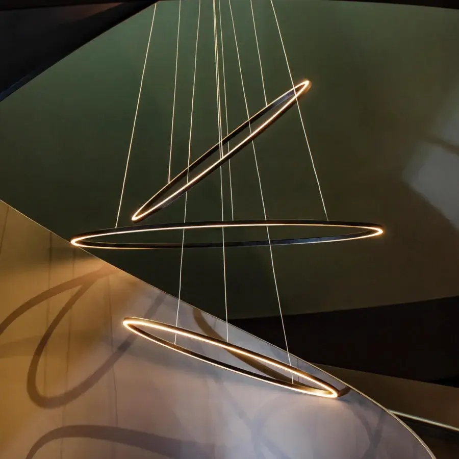 Innovative Nemo Lighting Ellisse Triple Suspension Lamp with interconnected ring fixtures and sleek black outer frame diffusing integrated LEDs