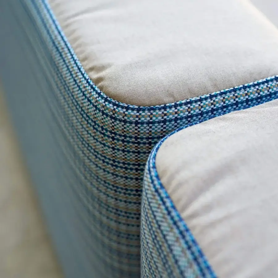 Exceptional Varaschin Belt sectional crafted with light beige woven textile and patterned trim in blue, brown, and white hues