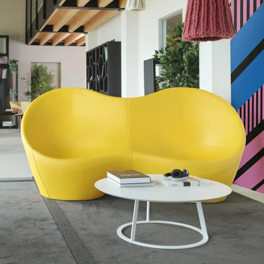 Exceptional Casamania Kouch sofa presents organic form upholstered in bright yellow synthetic fabric with seamless construction