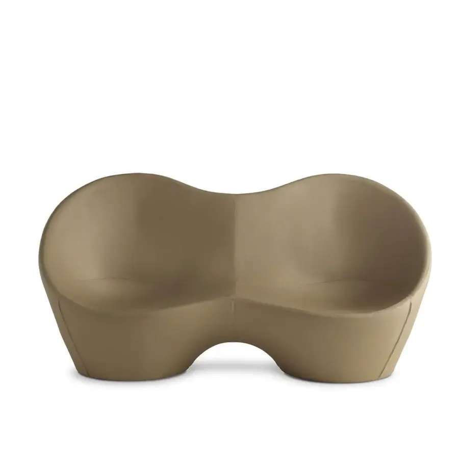 Captivating Casamania Kouch sofa presents a voluptuous organic form upholstered in premium synthetic leather with subtle shadows