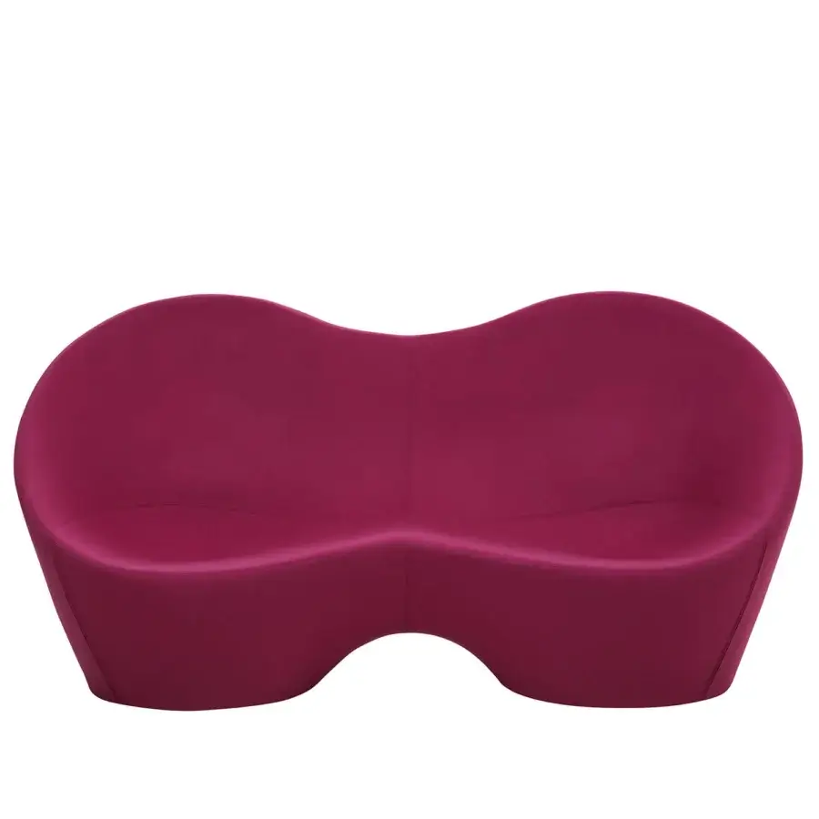 Exclusive Casamania Kouch sofa presents a voluptuous ergonomic form upholstered in smooth deep magenta textile with internal metal structure