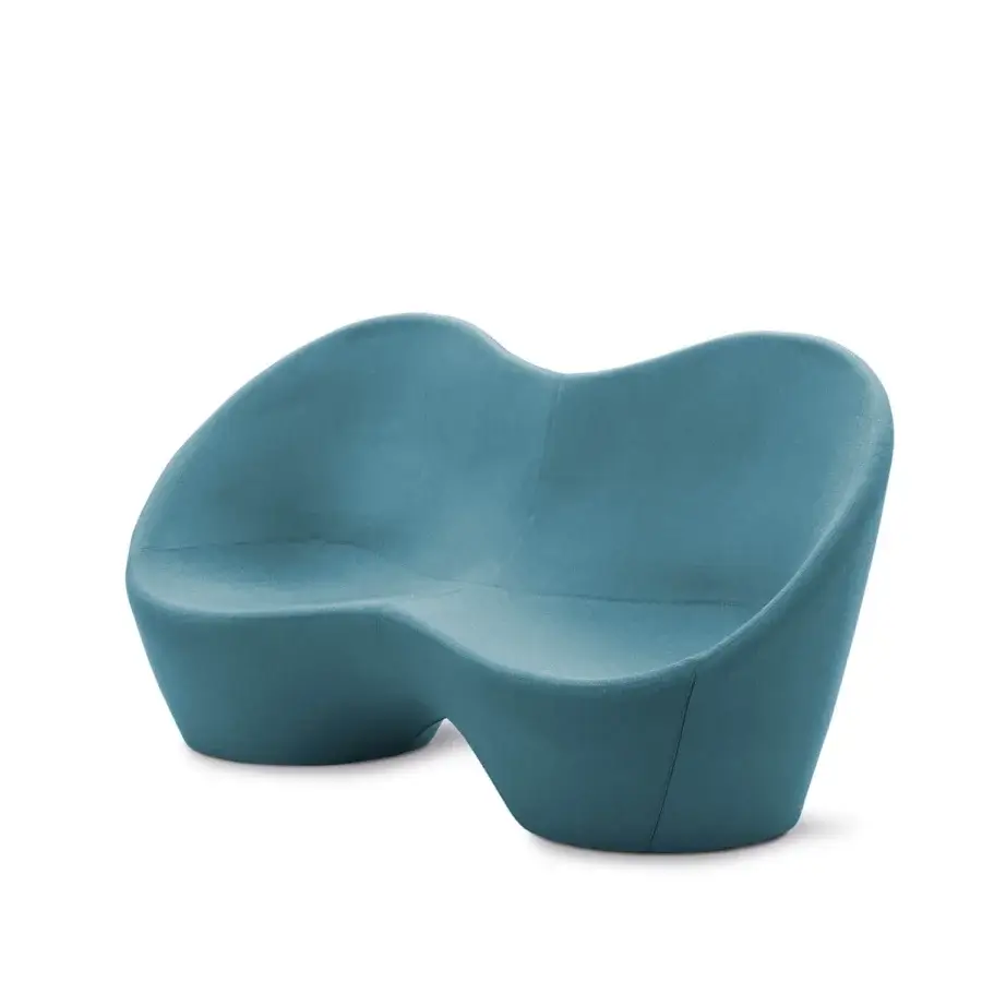 Superior Casamania Kouch sofa presents a voluptuous organic form upholstered in blue textile material with matte finish