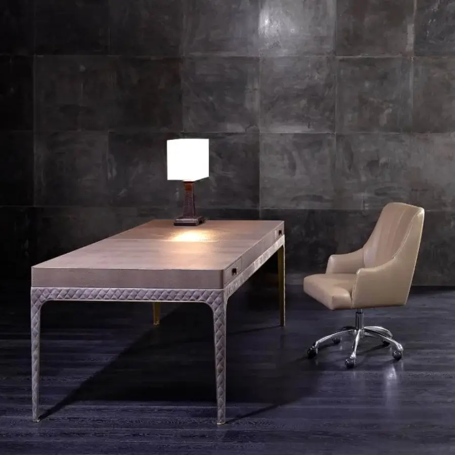 Elegant Rugiano Coline desk with tan tabletop, cushioned edge, brushed steel legs and refined matelassé embroidery