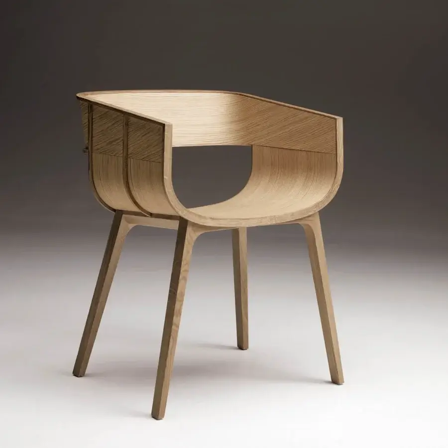 Refined Casamania Maritime armchair built in solid oak with smooth matte finish and curved flowing design