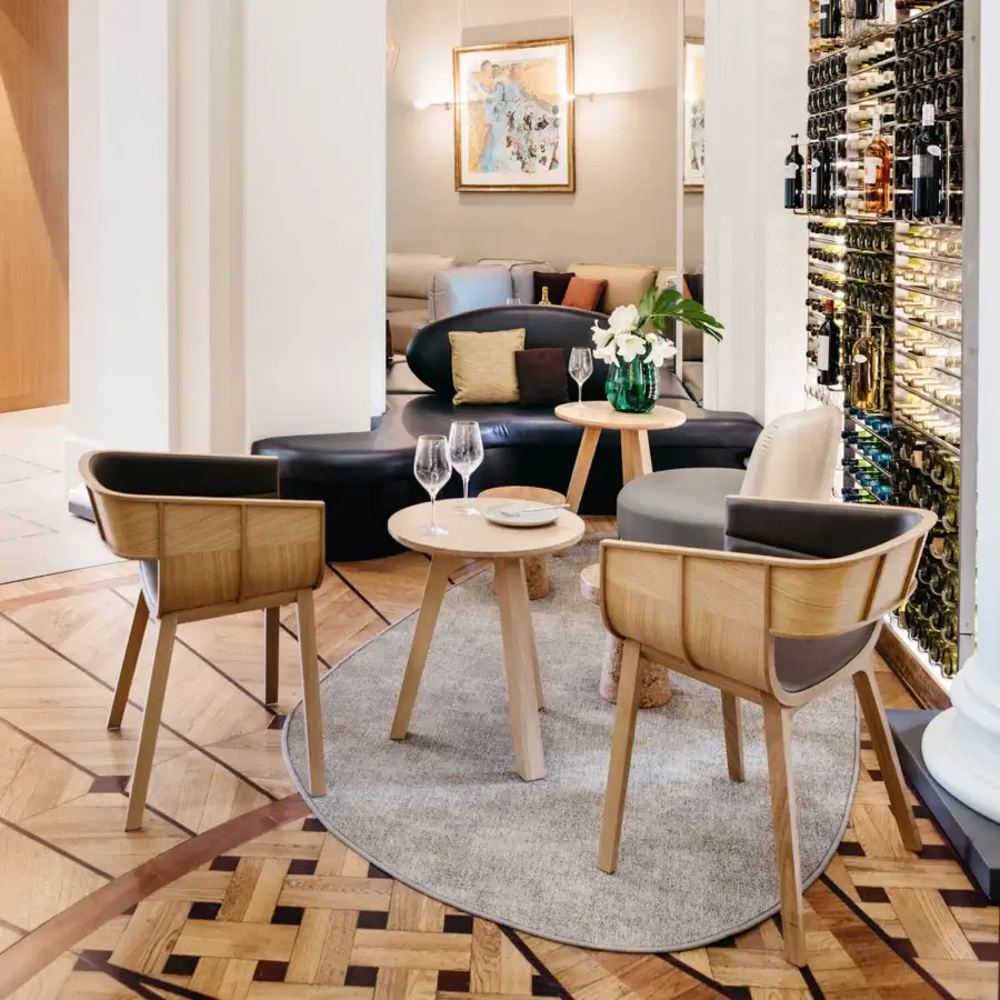 Distinguished Casamania Maritime armchair crafted from solid oak with sinuous curves and a contrasting dark seat