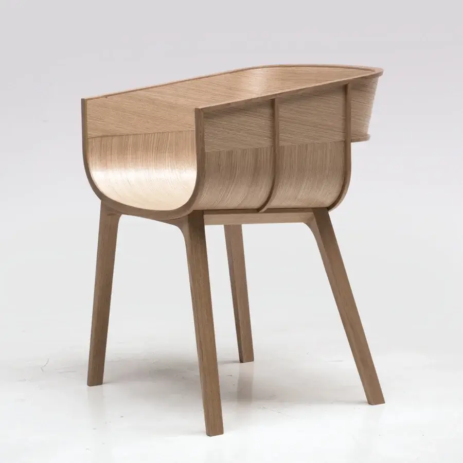 Distinguished Casamania Maritime armchair crafted from solid oak with curved silhouette and light brown natural wood grain