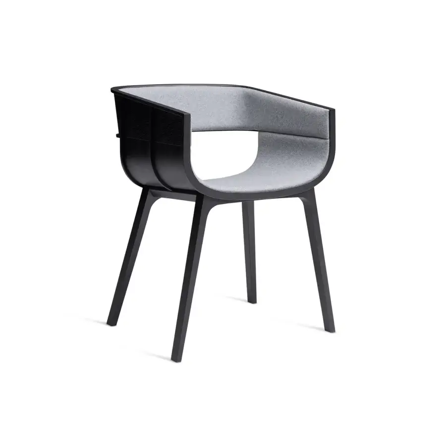 Sophisticated Casamania Maritime armchair built with dark matte solid oak and light gray upholstery showcasing curved surfaces