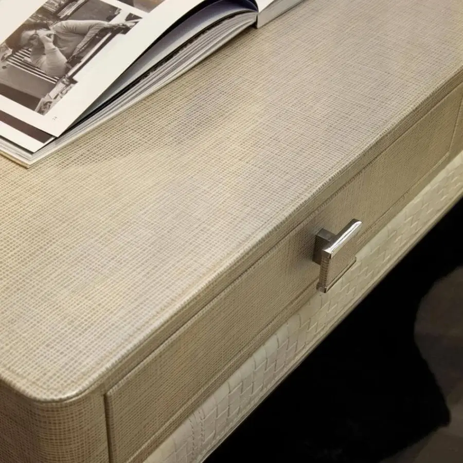 Exclusive Rugiano Coline desk with light beige textile and steel finish, showcasing matelassé embroidery and two rectangular drawer pulls