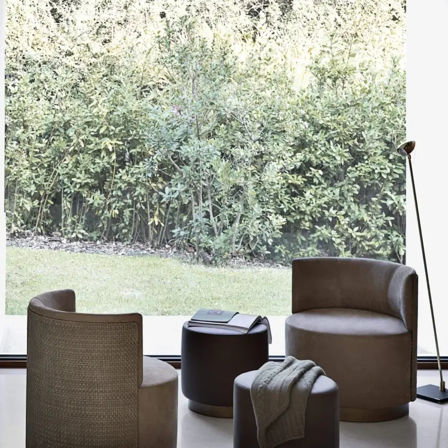 Elegant Frag Clubby ottoman inspired by European smoking clubs upholstered in smooth medium-brown textile crafted in Italy