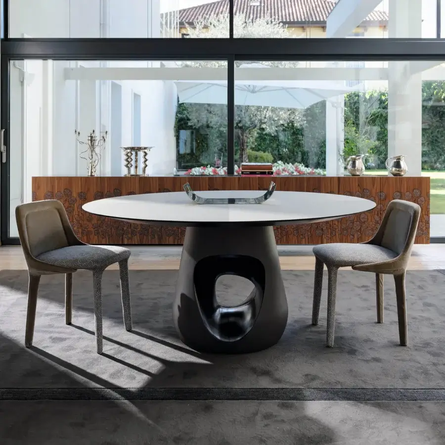 Distinctive Casamania Lepel chair built with light brown wood and grey-white curved fabric upholstery presenting a contemporary silhouette