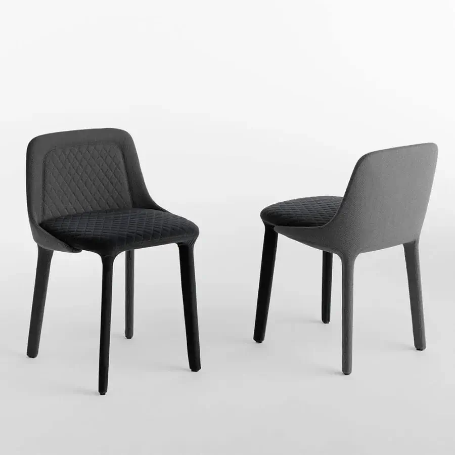 Distinguished Casamania Lepel chair crafted in dark premium fabric with quilted seat and sleek legs