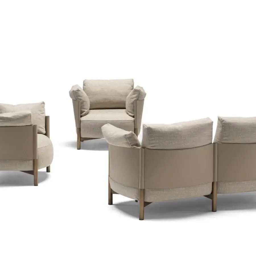 Superior Frag Syren lounge chair with a bronze-finished metal frame and plush beige textured textile cushion for ultimate comfort