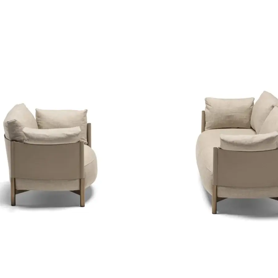 Distinguished Frag Syren lounge chair with beige textile upholstery and a light brown leather band wrapped around a matte-finish wooden frame