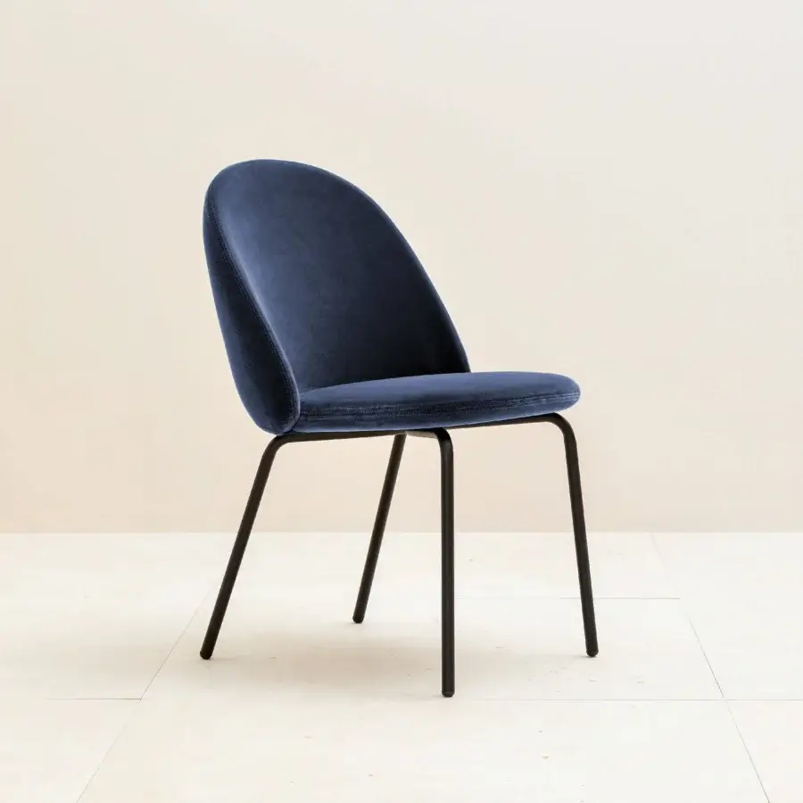 Elegant Miniforms Iola chair with deep blue plush textile upholstery and sleek matte black metal legs