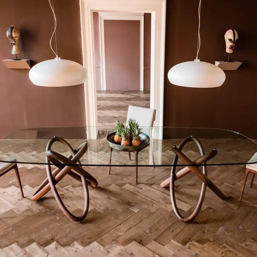 Superior Cattelan Italia Carioca table with clear glass top and sculpted solid Canaletto walnut base exhibiting a smooth finish