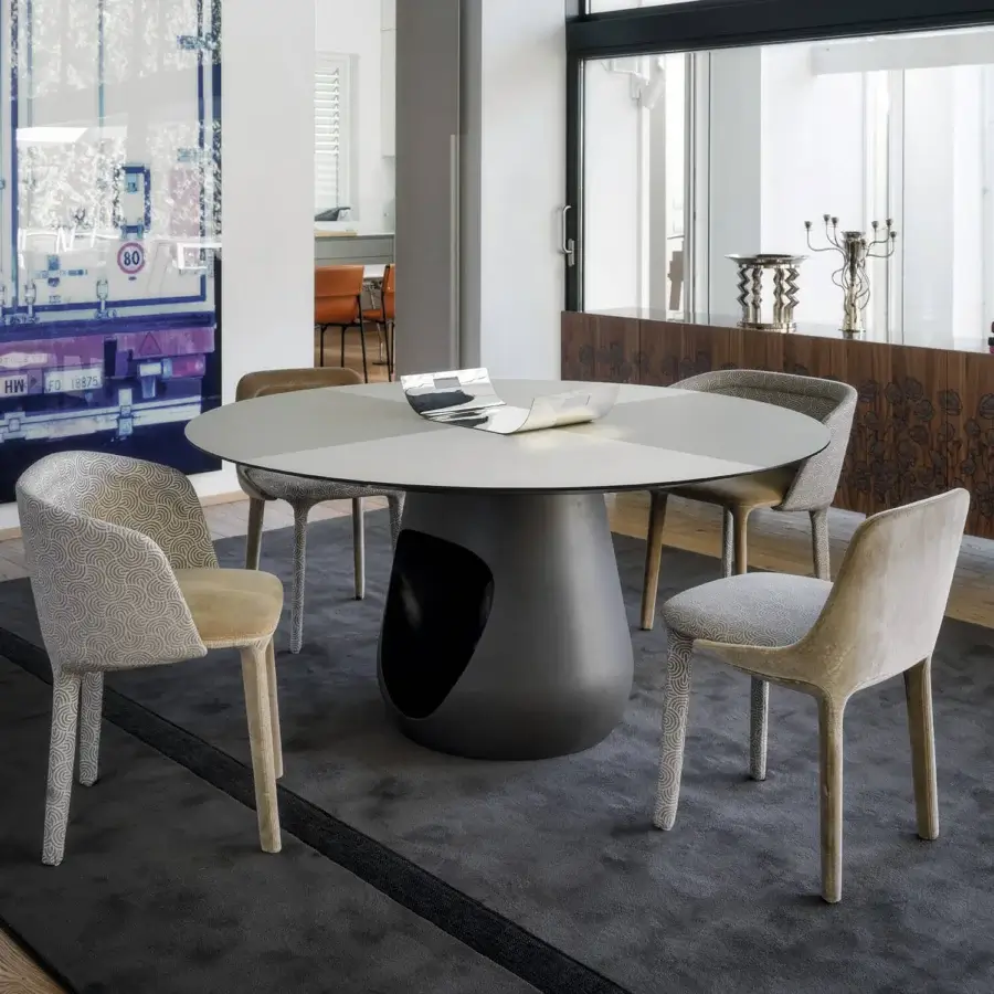 Superior Casamania Lepel armchair fully upholstered in beige fabric with a subtle circular pattern and textile covered legs