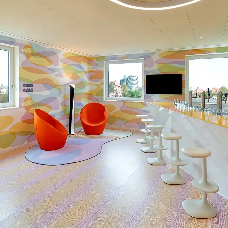 Superior Casamania Ouch lounge chair presents a voluptuous organic form upholstered in vibrant orange fire-retardant fabric with a metal structure