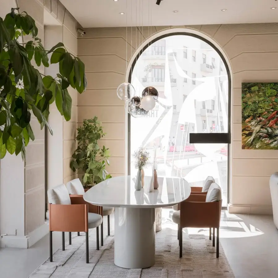 Distinguished Frag Syren armchair exhibits a boxy design with a light-brown matte frame supporting white textile cushions