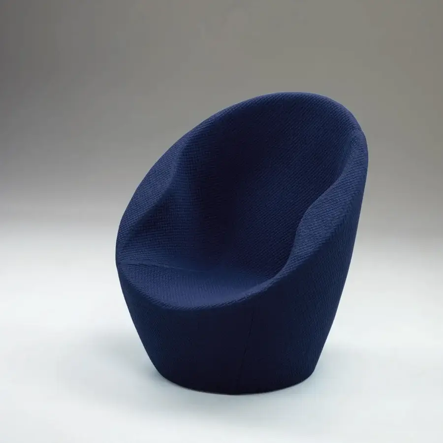 Superior Casamania Ouch lounge chair presents a voluptuous organic form upholstered in textured matte navy blue fabric with a metal structure