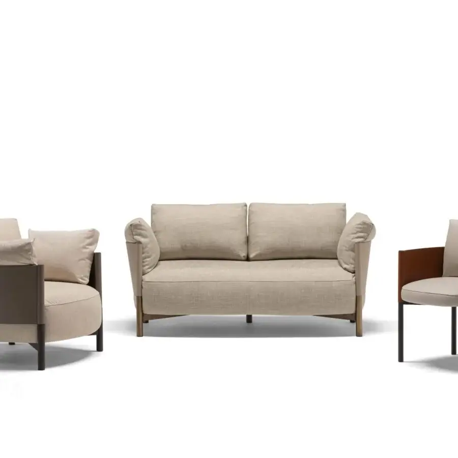 Superior Frag Syren armchair articulates balance with neutral textile upholstery, reddish-brown armrests and a movable soft cushion for comfort