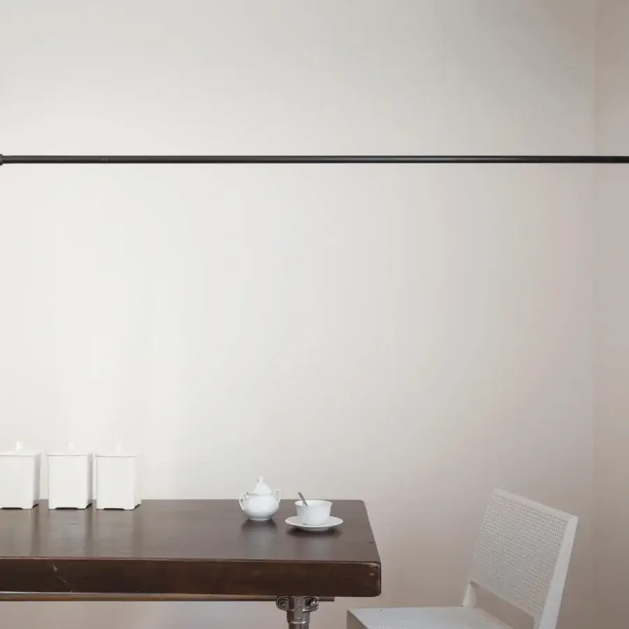 Distinguished Nemo Lighting Potence Pivotante wall lamp with a matte black steel arm and bright white spherical bulb