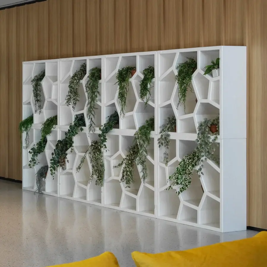 Innovative Casamania Opus Incertum bookcase with geometric cells built from lightweight expanded polypropylene in solid white