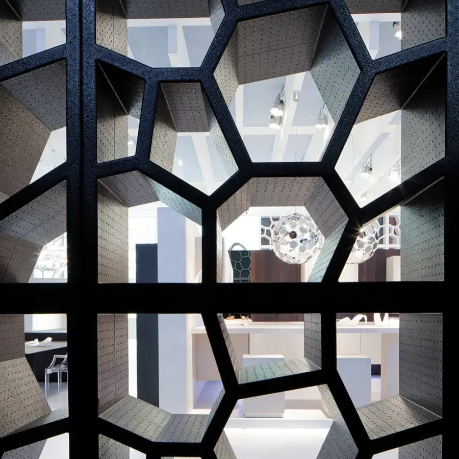 Distinguished Casamania Opus Incertum bookcase built in matte black expanded polypropylene with interconnected geometric openings