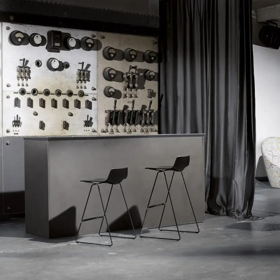 Distinguished Casamania Pressious stool in geometric form with matte black finish and angled metal legs