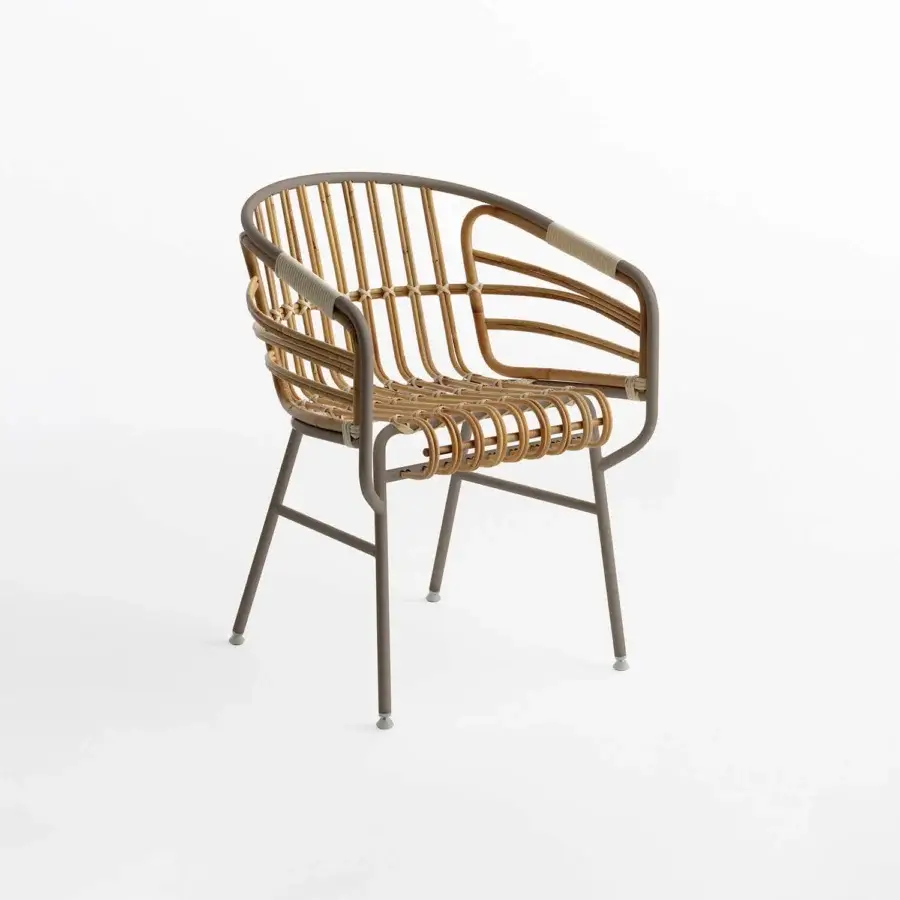Distinguished Casamania Raphia armchair built in woven light tan rattan with a matte gray-brown metal frame