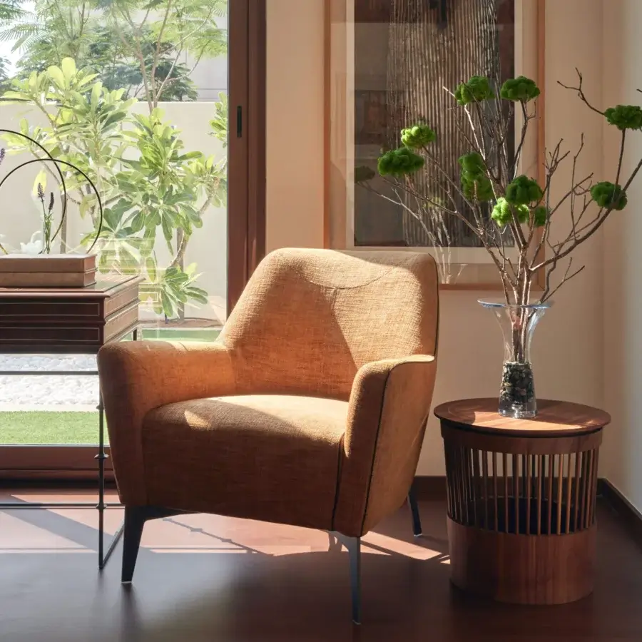 Refined Borzalino Eve Plus lounge chair with light brown textile upholstery and subtly textured matte finish