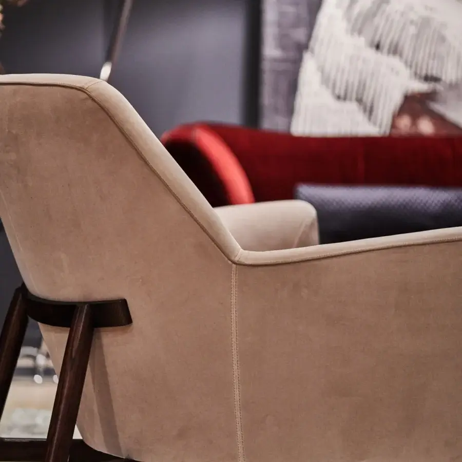 Meticulous Borzalino Eve Plus lounge chair crafted with light tan textile upholstery and a lacquered dark oak base