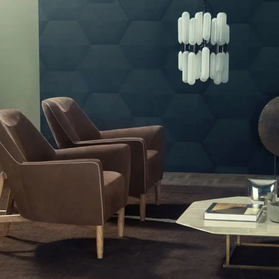 Elegant Borzalino Eve Plus lounge chair upholstered in rich brown textile with lacquered oak legs