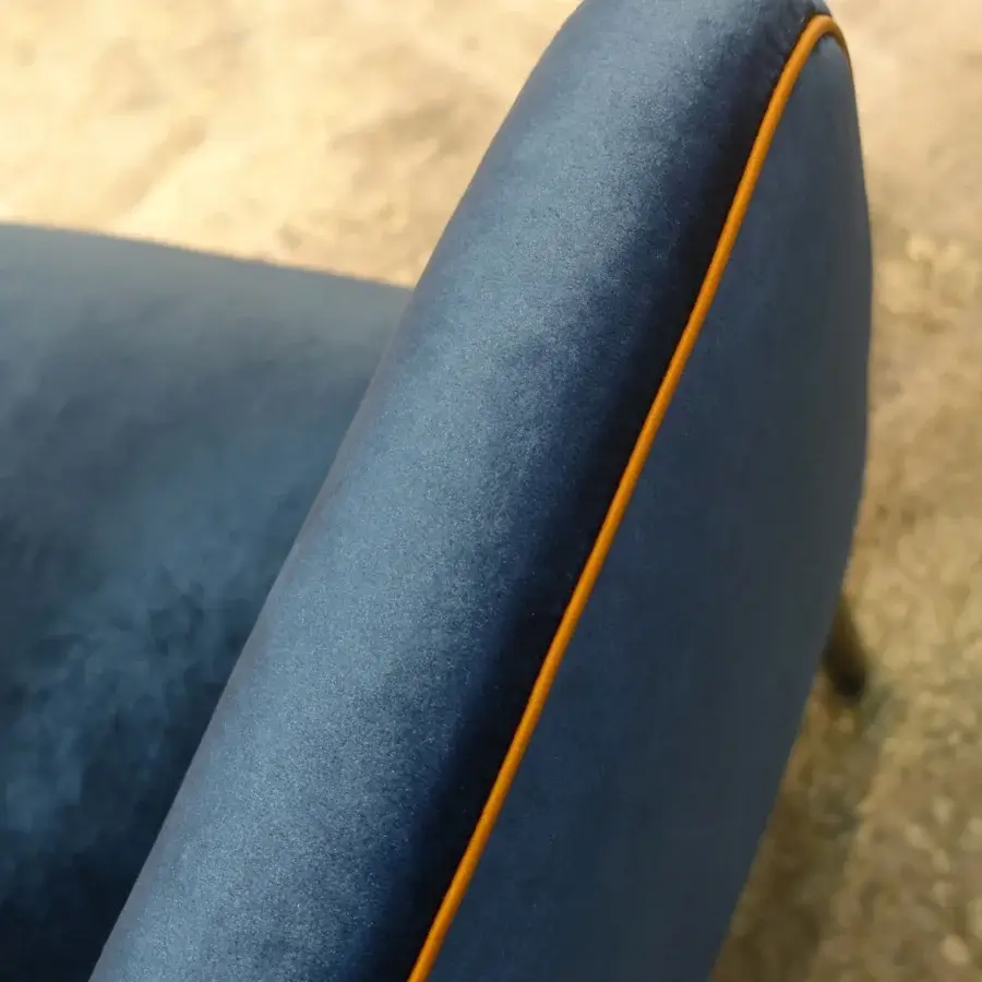 Refined Borzalino Eve Plus lounge chair in deep blue velvet textile with orange gros-grain piping and lacquered oak base crafted by skilled artisans