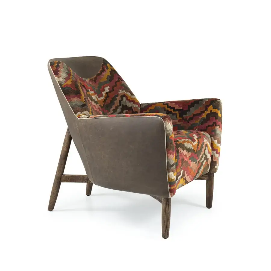 Lavish Borzalino Eve Plus lounge chair upholstered in zigzag textile with brown synthetic material and lacquered oak legs