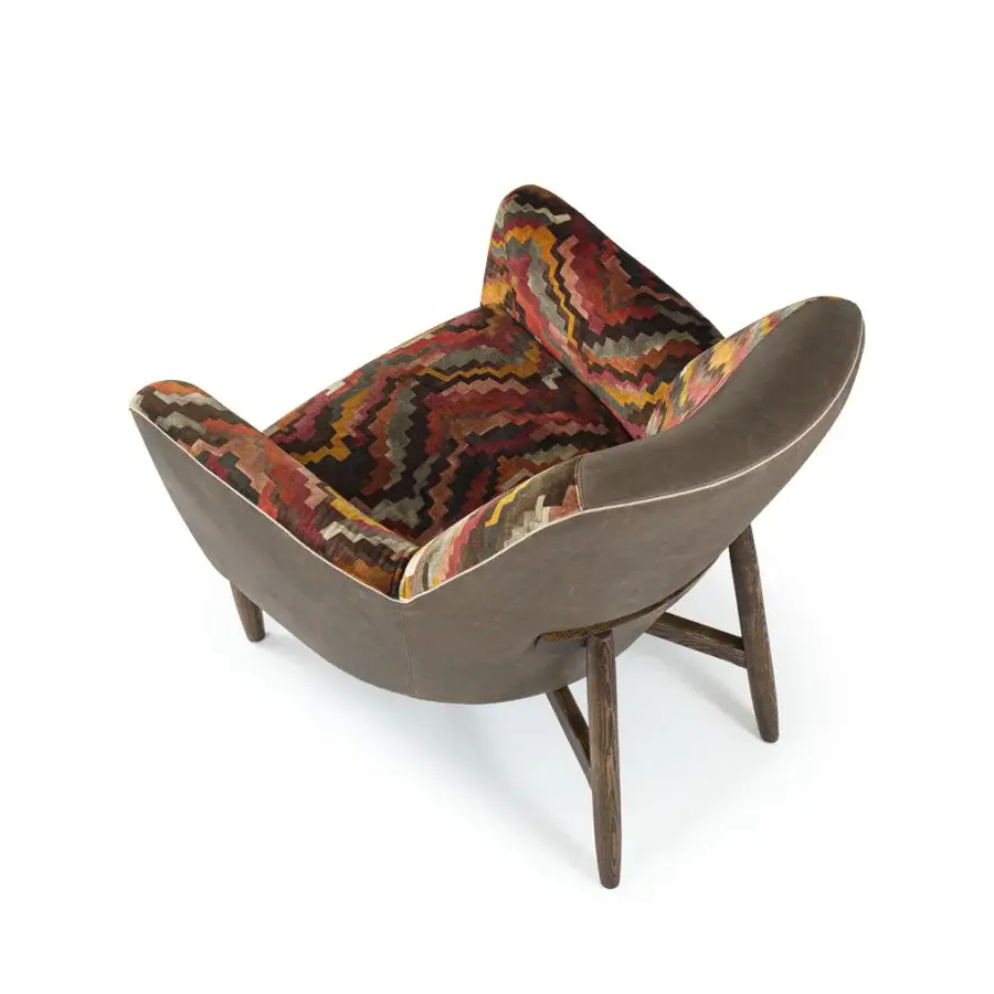 Superior Borzalino Eve Plus lounge chair upholstered in patterned fabric with brown leather and lacquered oak base